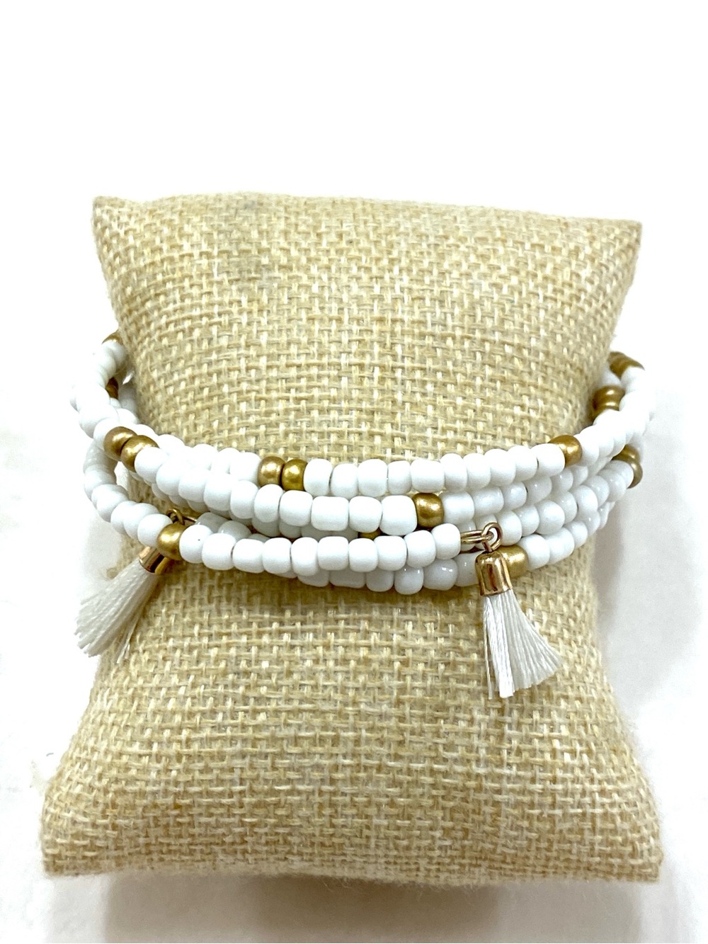 White & Gold Beaded Coil Bracelet with Tassel Detail